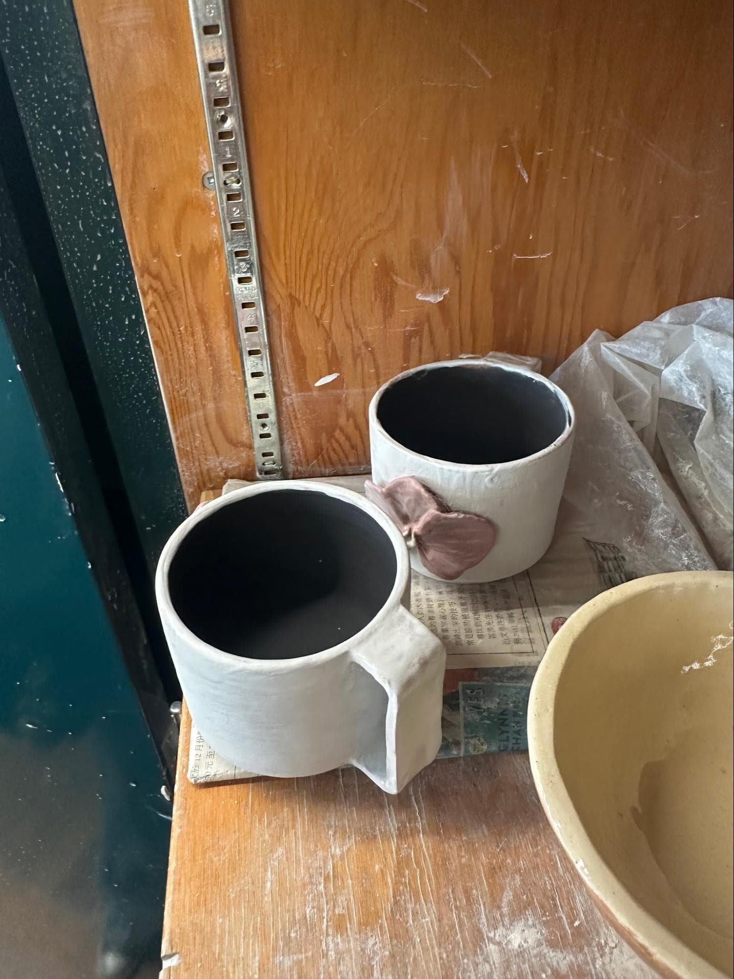 Doubled Orchid Cups · sketch → bisqueware → glazed → glazeware · trimmed to fit · Handbuilt floral and handle — Ceramic work by RuiXuan Xu — School