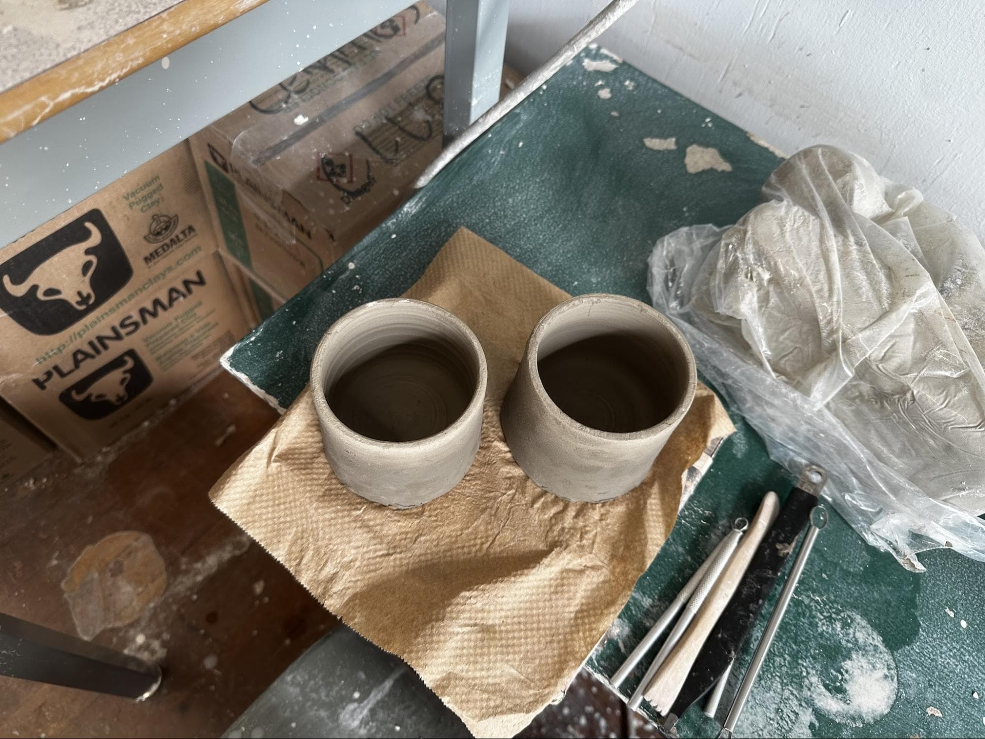 Doubled Orchid Cups · sketch → bisqueware → glazed → glazeware · trimmed to fit · Handbuilt floral and handle — Ceramic work by RuiXuan Xu — School